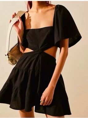FREE PEOPLE Cross Of Sunlight Mini Cutout Dress in black. Size L